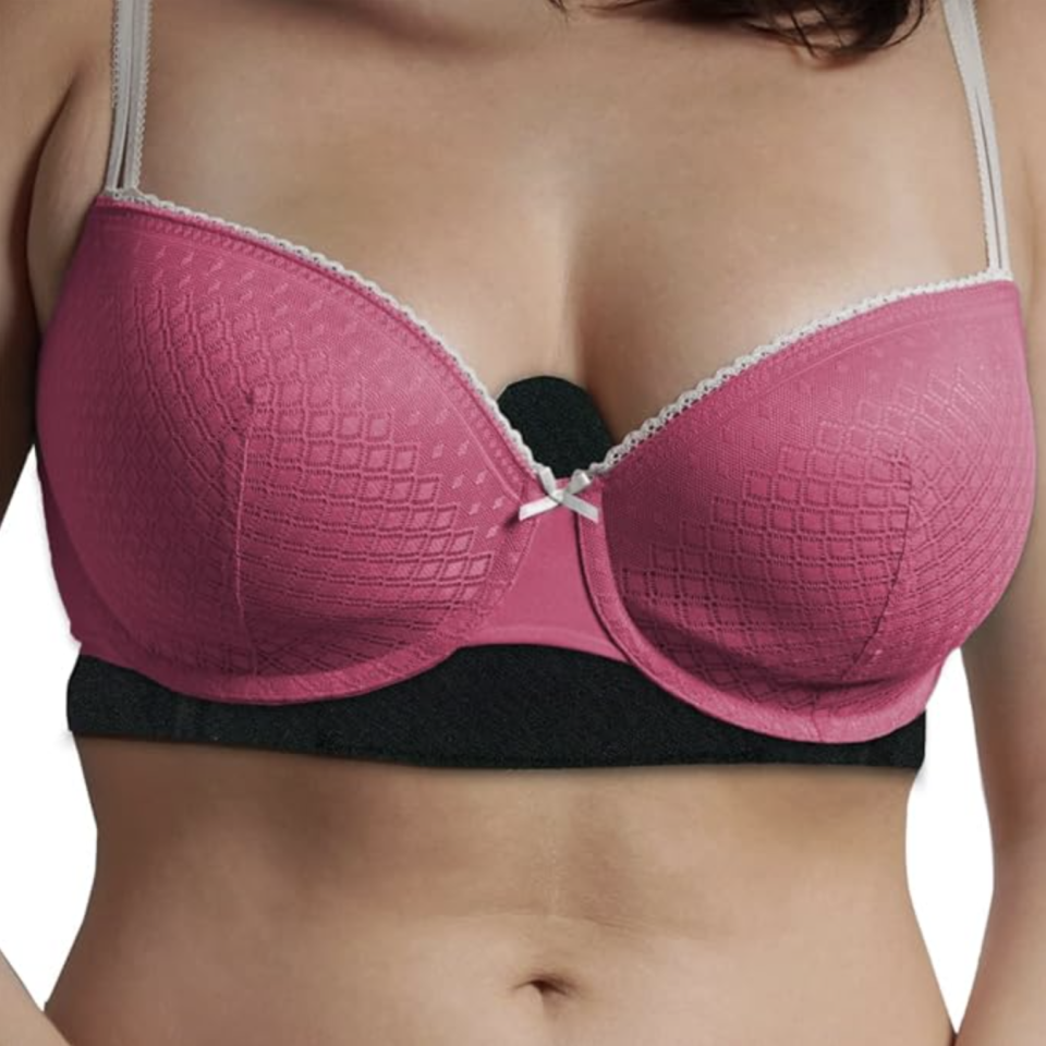 woman wearing pink bra with black bra liner underneath