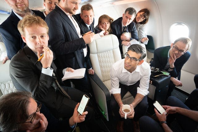 Prime Minister Rishi Sunak holds a huddle with political journalists on board a government plane as he heads to Japan to attend the G7 summit in Hiroshima 