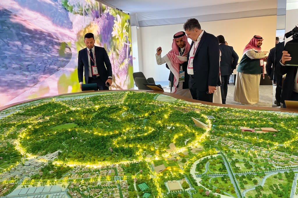 Convention-goers view a model of King Salman Park—one of the $1.4 trillion worth of oil-funded construction projects underway in Saudi Arabia.