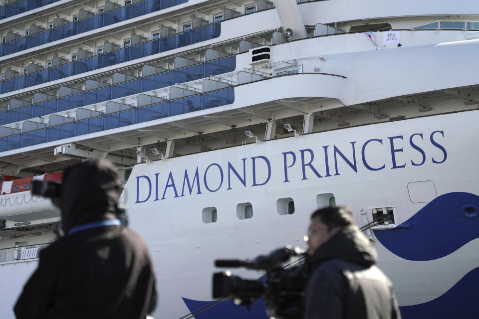 The quarantined cruise ship Diamond Princess is anchored in the Yokohama Port Sunday, Feb. 9, 2020. Japan on Saturday reported three more cases of the coronavirus aboard the Diamond Princess for a total of 64 . There are 3,700 passengers and crew on the Diamond Princess who must remain on board for 14 days. (AP Photo/Eugene Hoshiko)