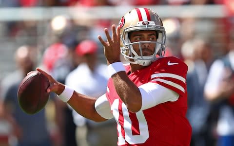 San Francisco 49ers quarterback Jimmy Garoppolo drops back to throw during the first half of an NFL football game against the Detroit Lions - Credit: AP Photo/Ben Margot