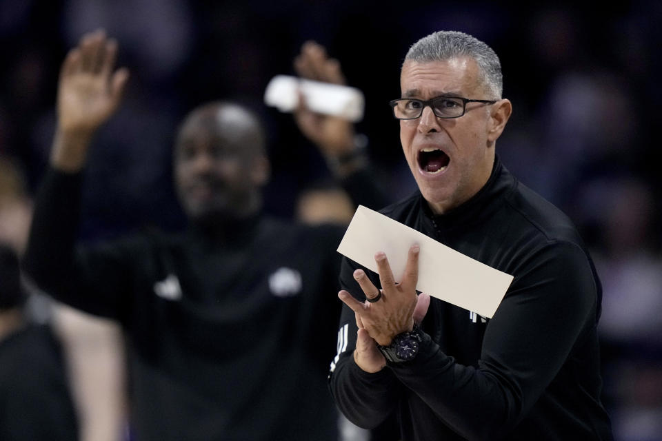 North Alabama head coach Tony Pujol talks to his players during the first half of an NCAA college basketball game against Kansas State Saturday, Dec. 2, 2023, in Manhattan, Kan. (AP Photo/Charlie Riedel)