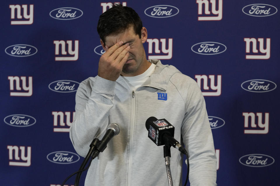 New York Giants quarterback Daniel Jones (8) rubs his eyes during a post NFL football game news conference, Sunday, Oct. 8, 2023, in Miami Gardens, Fla. The Dolphins defeated the Giants 31-16. (AP Photo/Wilfredo Lee)