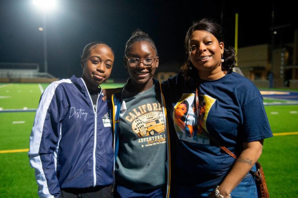 Danyelle Harris, who is Kyla Watkin’s aunt, and two of Kyla’s friends, Destiny, left, and Azaria, center, after a candlelight vigil in honor of three Gautier High School graduates at Gautier High School involved in a fatal crash in Gautier on Thursday, Dec. 7, 2023. Se’Dhari Saniya Watson-Person, Kyla “Muffin” Watkins, and Tatyanna Richmond were involved in a fatal crash on Tuesday, leading to the deaths of Watson-Person and Watkins.