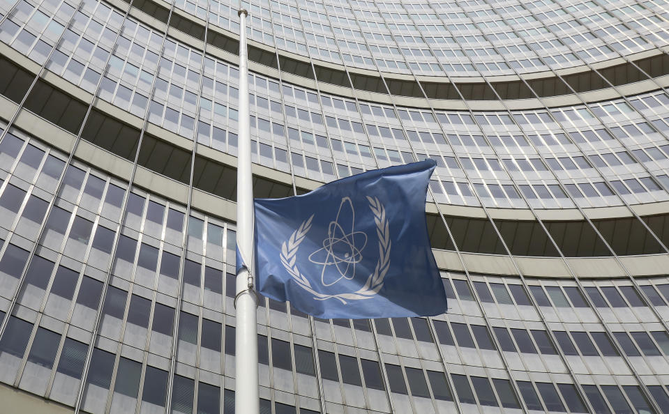 A flag is set to half mast in front of the International Atomic Energy Agency (IAEA) building in Vienna, Austria, Monday, July 22, 2019. The IAEA announced the death of the agency's Director General Yukiya Amano at the age of 72 years. (AP Photo/Ronald Zak)