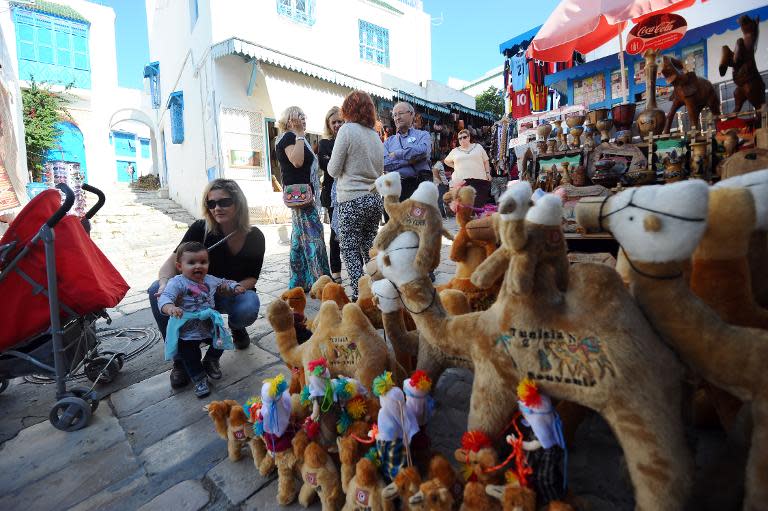 File picture shows tourists looking at souvenirs in the suburb of Sidi Bou Said near Tunis