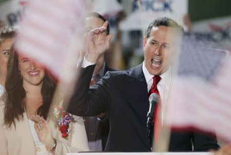 Republican presidential candidate and former U.S. Senator Rick Santorum speaks to the crowd after formally declaring his candidacy for the 2016 Republican presidential nomination during an announcement event in Cabot, Pennsylvania, May 27, 2015. Daughter Elizabeth is at left. REUTERS/Aaron Josefczyk