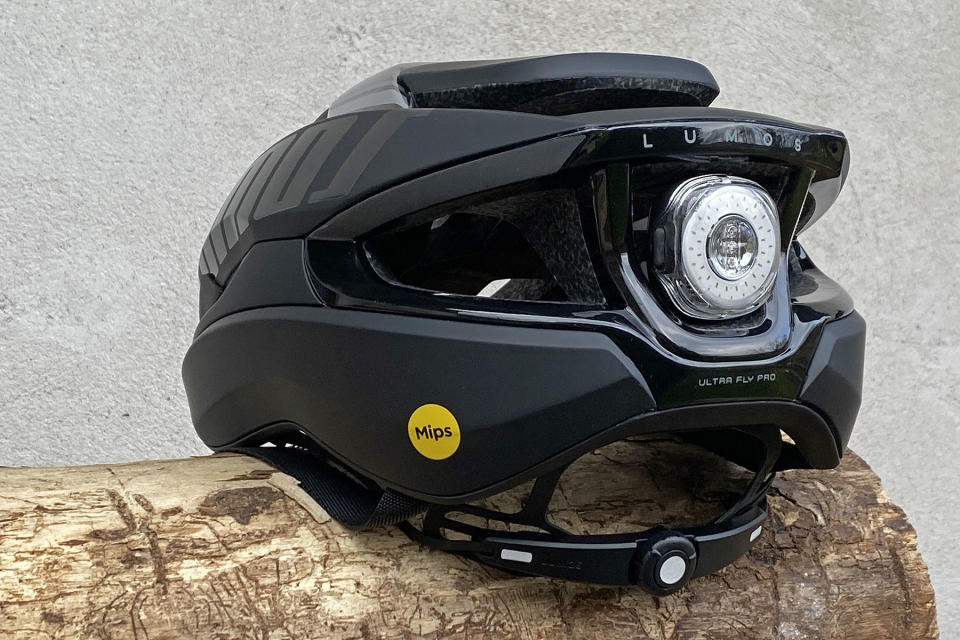 Lumos Ultra Fly Pro MIPS performance road helmet with built-in Firefly taillight, rear detail