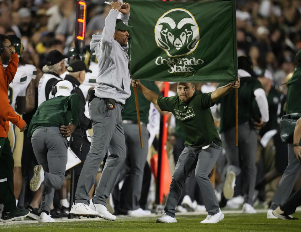 Colorado State head coach Jay Norvell, front left, jumps while calling plays in the first half of an NCAA college football game against Colorado, Saturday, Sept. 16, 2023, in Boulder, Colo. (AP Photo/David Zalubowski)