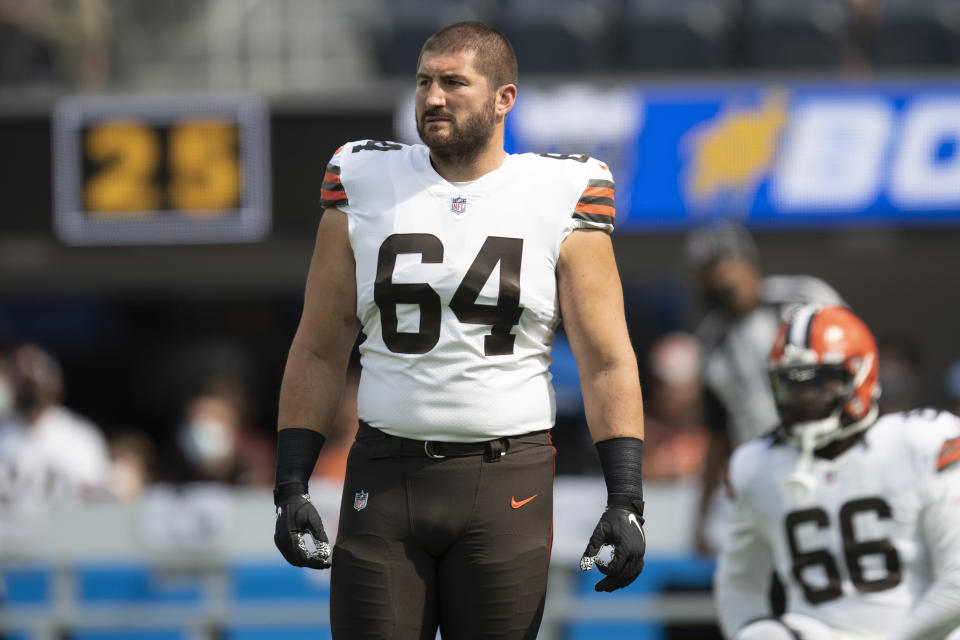 FILE - Cleveland Browns center JC Tretter (64) warms up before an NFL football game against the Los Angeles Chargers Sunday, Oct. 10, 2021, in Inglewood, Calif. Former Browns and Packers center JC Tretter announced his retirement Thursday, Aug. 25, 2022, after eight seasons in the NFL. Tretter, the current president of the NFL Players Association, only missed one game for Cleveland over the past five seasons despite battling injuries. He said on Twitter that he's decided “to stop playing when I wanted to — on my own terms.”(AP Photo/Kyusung Gong)