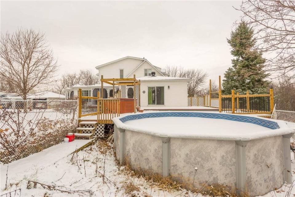 <p>Out back, there’s a large deck and an above-ground pool. </p>