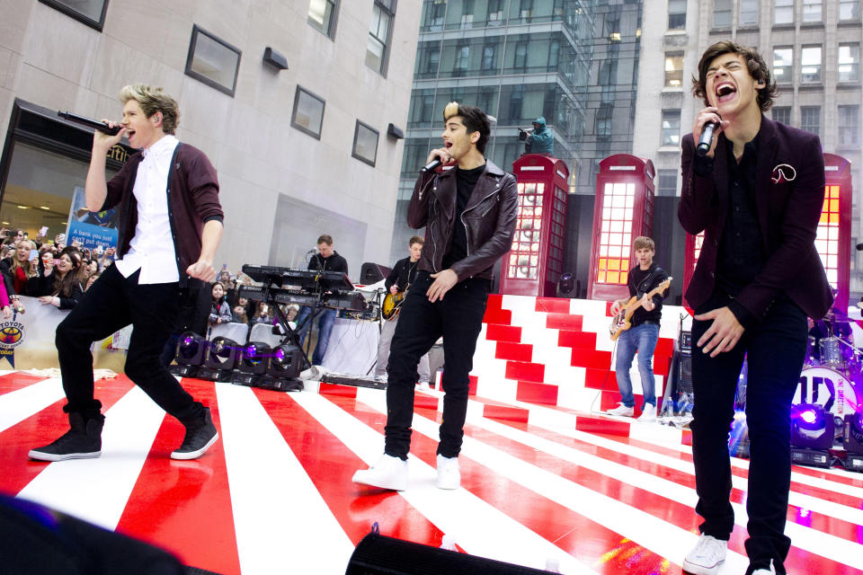 One Direction members, from left, Niall Horan, Zayn Malik and Harry Styles perform on NBC's "Today" show on Tuesday, Nov. 13, 2012 in New York. (Photo by Charles Sykes/Invision/AP)