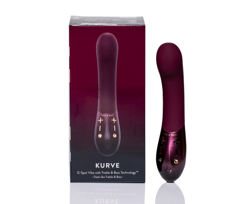 The KURVE G-spot vibrator in maroon standing next to its maroon box on the left against a white background