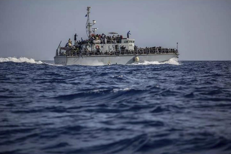 FILE - This June 24, 2018 file photo, released by the Libyan Coast Guard, shows migrants on a ship intercepted offshore near the town of Gohneima, east of the capital, Tripoli, Libya. On Wednesday, Feb. 12, 2020, Human Rights Watch, a leading rights group, said that Italy’s renewed support for the Libyan coast guard is putting migrants at risk who are returned to squalid detention centers in the North African country. The group urged that Italy suspend all funding and training for the coast guard until Libya commits to shutting down militant-run detention centers in the country. (Libyan Coast Guard via AP, File)