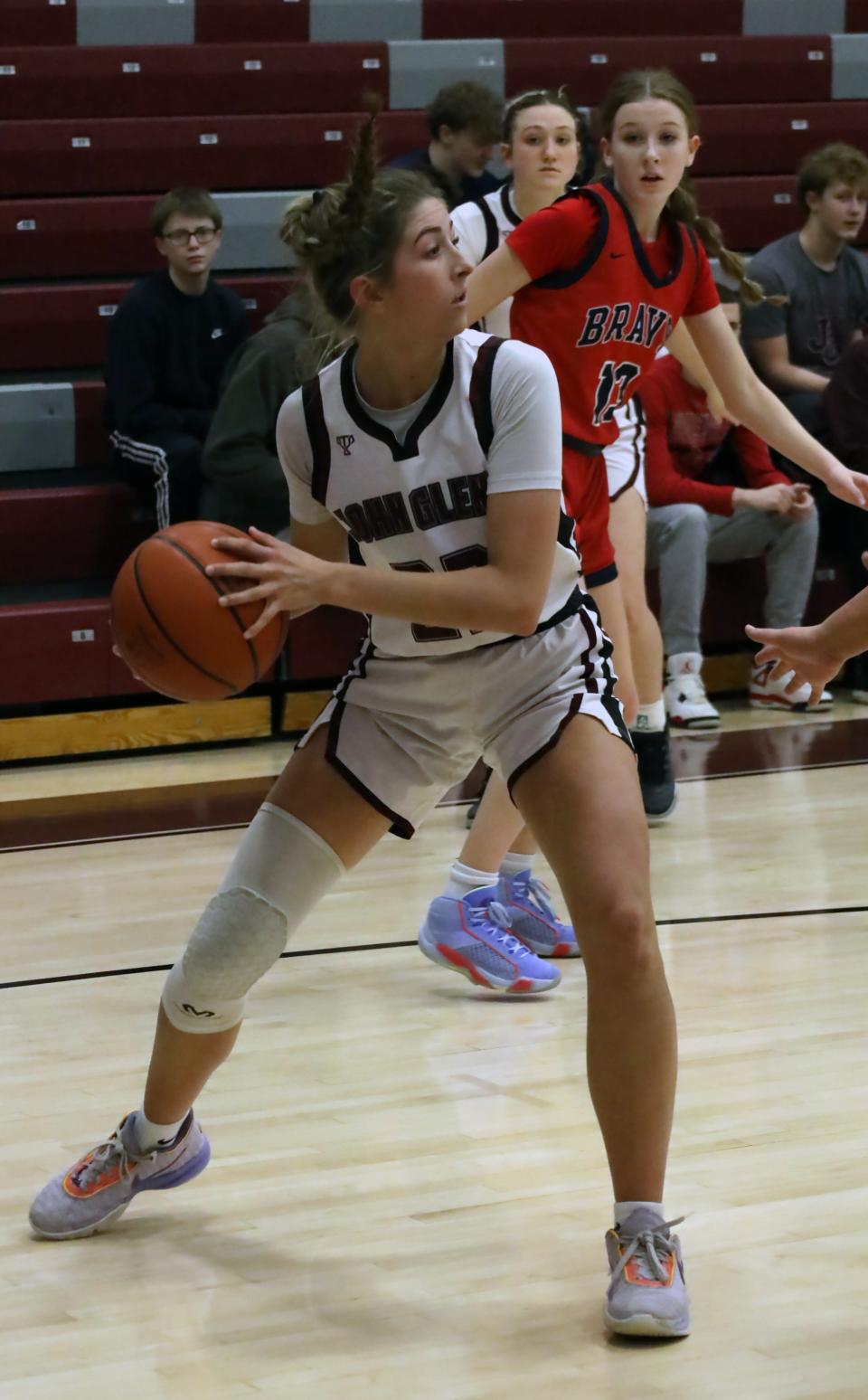 John Glenn's Aleea Musselman (23) looks to pass the ball during the D-II girls' basketball tournament game at John Glenn High School Saturday afternoon.