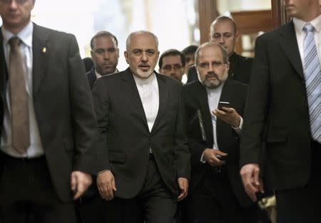 Iranian Foreign Minister Javad Zarif (C) leaves a meeting with U.S. Secretary of State John Kerry and other U.S. officials at the Beau Rivage Palace Hotel March 26, 2015 in Lausanne, Switzerland. REUTERS/Brendan Smialowski/Pool