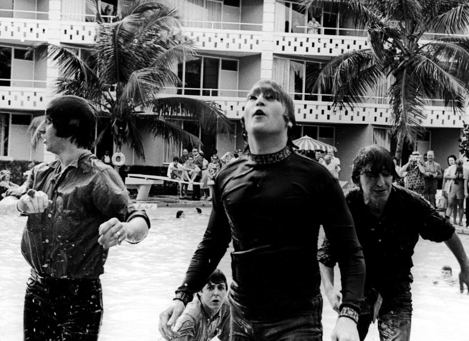 <p>The Beatles climb out of a pool while filming a movie, tentatively called, <em>Beatles 2</em>, in the Bahamas in 1965.</p>