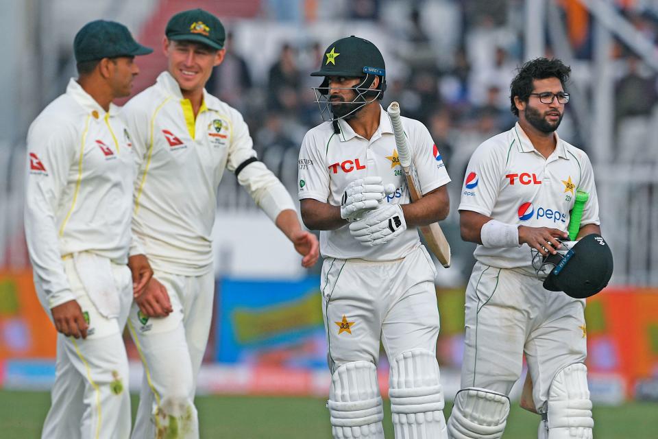 Players, pictured here walking off the field after the first Test between Australia and Pakistan ended in a draw.