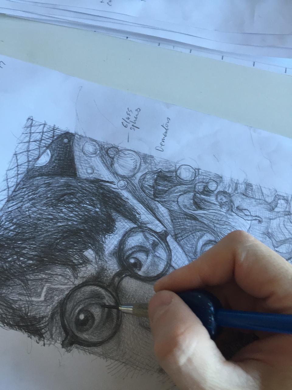 East Brunswick's Brian Selznick works one of the sketches the 20th anniversary covers of the Harry Potter series. The books were released in June 2018.