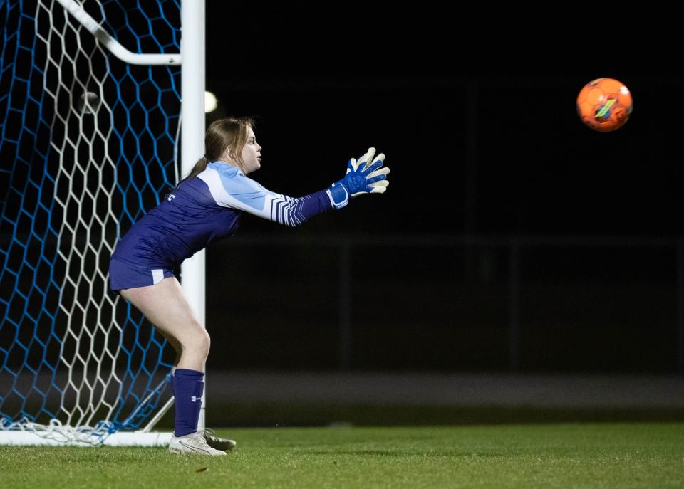 Zoey Mattes (0) makes a save during the Navarre vs Pace girls soccer game at Pace High School on Wednesday, Jan. 10. 2024.