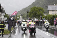 Cyclists take the start during the 16th stage of the Giro d'Italia cycling race, from Livigno to Santa Cristina Val Gardena (Monte Pana) Italy, Tuesday, May 21, 2024. The organizers changed the start from the village of Livigno to Lasa after calling off the first 85 kilometers (52.8 miles) of the stage due to bad weather conditions. (Fabio Ferrari/LaPresse via AP)