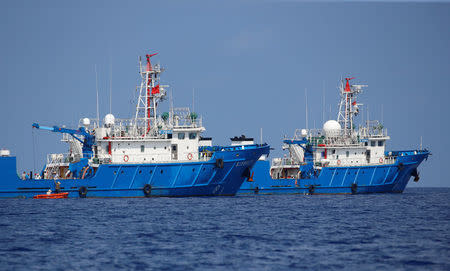 Chinese vessels are pictured at the disputed Scarborough Shoal April 6, 2017. Picture taken April 6, 2017 REUTERS/Erik De Castro
