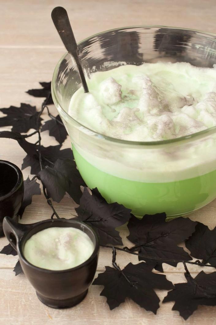 <p>This frightfully refreshing concoction is made from lemon-lime seltzer and lime sherbet.</p><p>Get the<strong> <a href="https://www.womansday.com/food-recipes/food-drinks/recipes/a11405/witchs-wicked-punch-recipe-122712/" rel="nofollow noopener" target="_blank" data-ylk="slk:Ghoulish Punch recipe" class="link ">Ghoulish Punch recipe</a>.</strong><br></p>