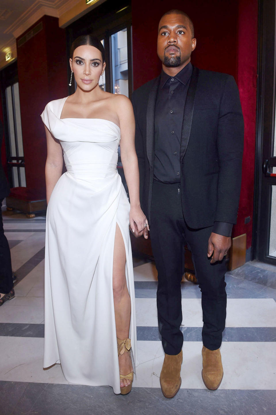 <p>Kim Kardashian in Valentino and Kanye West</p>