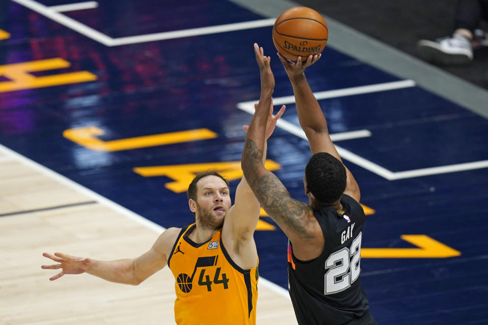 San Antonio Spurs forward Rudy Gay (22) shoots as Utah Jazz forward Bojan Bogdanovic (44) defends in the first half during an NBA basketball game Monday, May 3, 2021, in Salt Lake City. (AP Photo/Rick Bowmer)