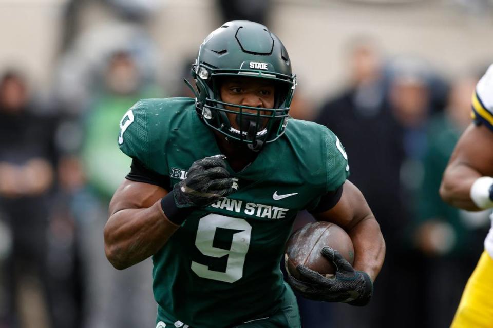 Michigan State’s Kenneth Walker III runs against Michigan during an NCAA college football game, Saturday, Oct. 30, 2021, in East Lansing, Mich. (AP Photo/Al Goldis)