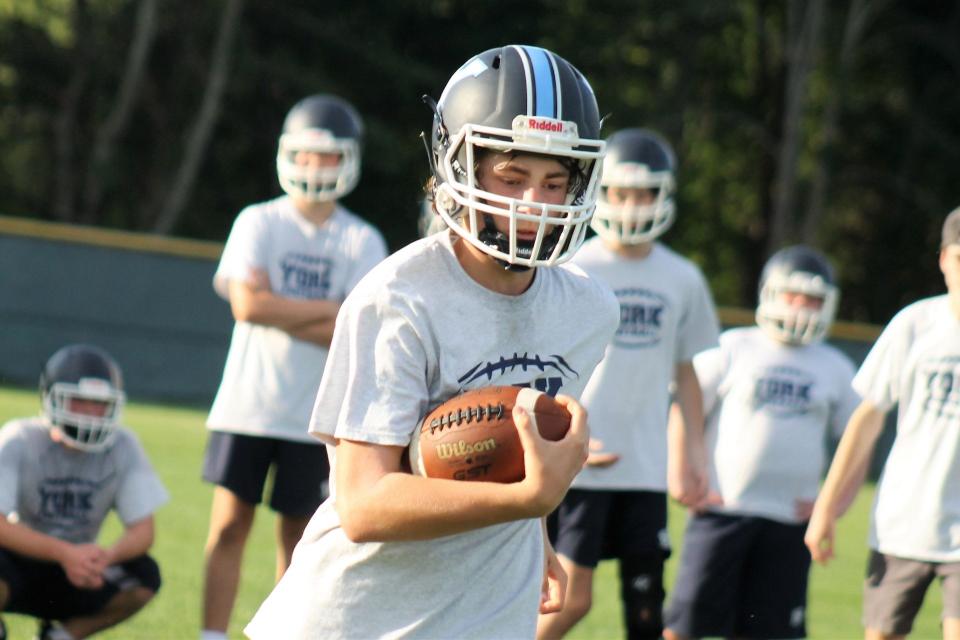 York High School's running backs, seen on the first day of practice Monday, Aug. 14, 2023, are expected to benefit from an experienced offensive line this season.