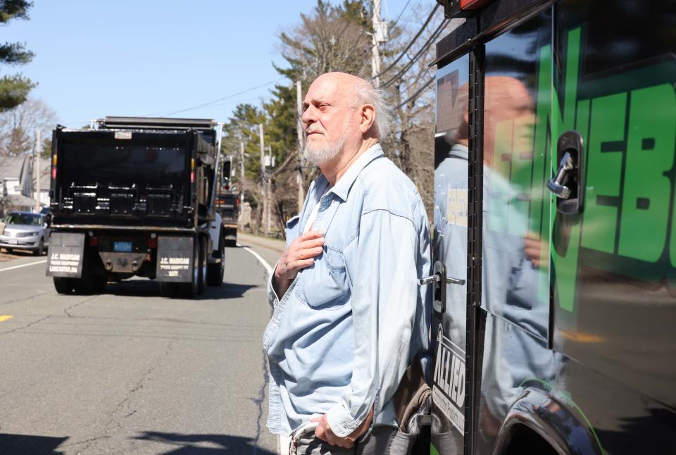 Anthony Monsini, the uncle of the late Peter Monsini, 51, of Easton, places his hand over his heart during a truck convoy  to honor his nephew on Saturday, April 2, 2022. Peter Monsini was killed in a construction accident when a parking garage collapsed at 1 Congress St. in Boston on March 26.