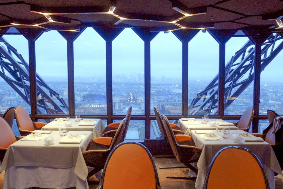 The Paris cityscape at dusk is viewed from the dining room of the Jules Verne Restaurant, on the second floor of the Eiffel Tower, in Paris, France, on Thursday, Jan. 17, 2008.