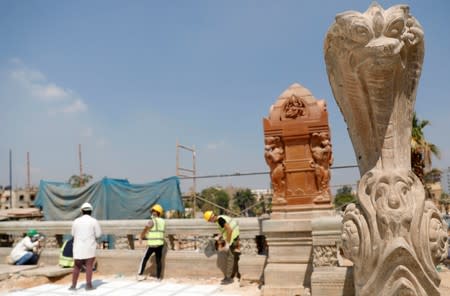 Egyptian workers carry out restoration work of the Baron Empain Palace, "Qasr el Baron" or The Hindu Palace, built in the 20th century by Belgian industrialist Edouard Louis Joseph, also known as Baron Empain, in the Cairo's suburb Heliopolis