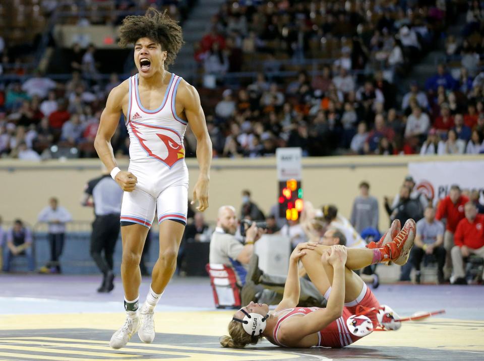 Collinsville's Cameron Steed celebrates beside Claremore's Kai Shultz after winning the Class 5A 152-pound championship at the state wrestling tournament Saturday night at State Fair Arena.