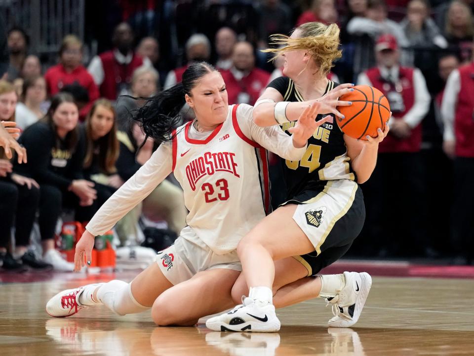 Ohio State forward Rebeka Mikulasikova (23) tries to steal the ball from Purdue Boilermakers forward Caitlyn Harper (34) during the fourth quarter of the Buckeyes' 73-65 loss.