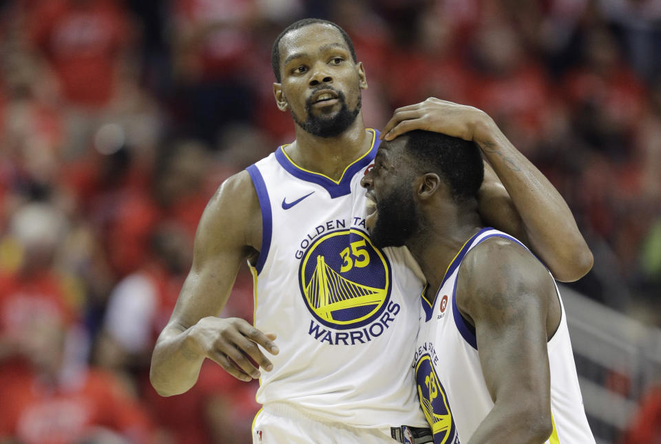 FILE - In this May 28, 2018, file photo, Golden State Warriors forward Kevin Durant (35) celebrates with teammate Draymond Green during the second half in Game 7 of the NBA basketball Western Conference finals against the Houston Rockets in Houston. A fifth straight trip to the NBA Finals would be an incredible feat. (AP Photo/David J. Phillip, File)