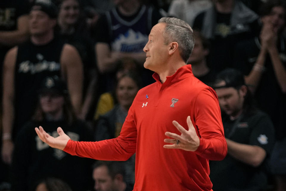 Texas Tech head coach Grant McCasland directs his players on the court during the first half of an NCAA college basketball game against Central Florida, Saturday, Feb. 24, 2024, in Orlando, Fla. (AP Photo/John Raoux)