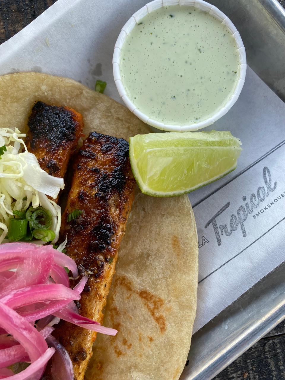 Tropical Smokehouse will be serving up mahi tacos (shown here) and brisket tacos with pickled onions and avocado salsa on house made soft tortillas for Cinco de Mayo.