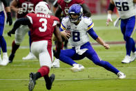 Minnesota Vikings quarterback Kirk Cousins (8) scrambles as Arizona Cardinals strong safety Budda Baker (3)pursues during the first half of an NFL football game, Sunday, Sept. 19, 2021, in Glendale, Ariz. (AP Photo/Ross D. Franklin)