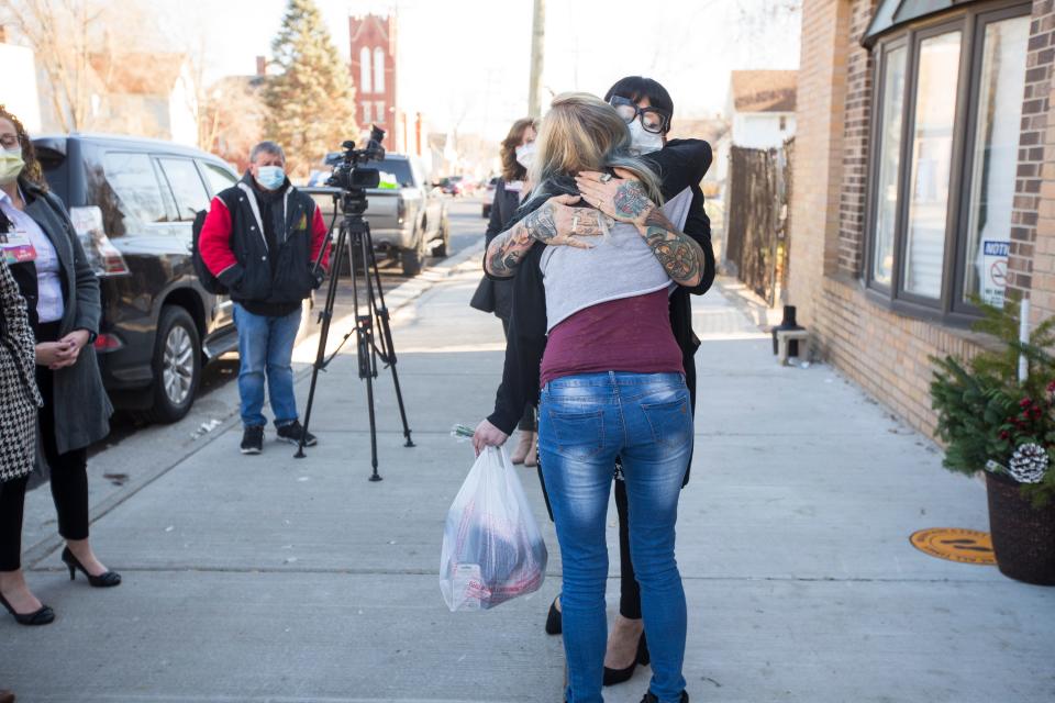 Carly Rice, facing camera, co-owner of Miss Carly's, hugs a woman who received help from the organization on Friday, Dec. 4, 2020, in Rockford. The SwedishAmerican Foundation presented Miss Carly's with the Commitment to Caring Award on Friday.