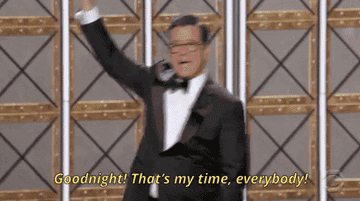 Stephen Colbert waving and saying, "Goodnight! That's my time, everybody!"