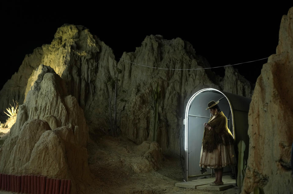 A contestant waits to compete in the Miss Cholita Pacena 2023 beauty pageant in Valle de La Luna on the outskirts of La Paz, Bolivia, Friday, June 23, 2023. The annual contest recognizes Aymara women's fashion and beauty as well as their command of their Indigenous lifestyle and language. (AP Photo/Juan Karita)