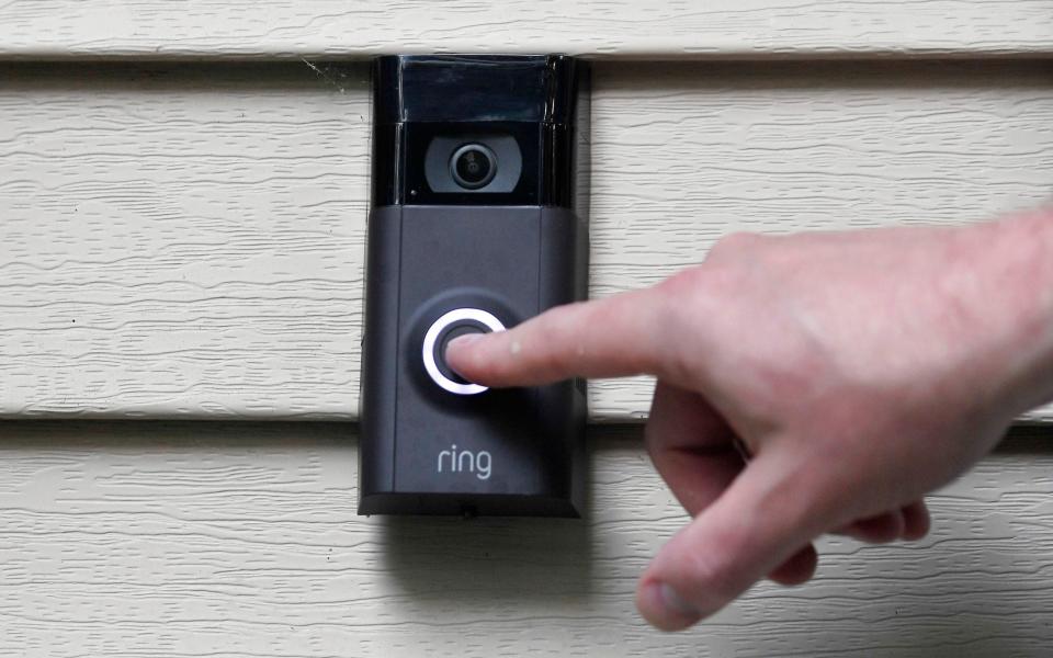 FILE - Ernie Field pushes the doorbell on his Ring doorbell camera, July 16, 2019, at his home in Wolcott, Conn. In a vote Wednesday, May 31, 2023, the Federal Trade Commission is ordering Amazon to pay more than $30 million in fines over privacy violations involving its voice assistant Alexa and its doorbell camera Ring. (AP Photo/Jessica Hill, File) - AP Photo/Jessica Hill