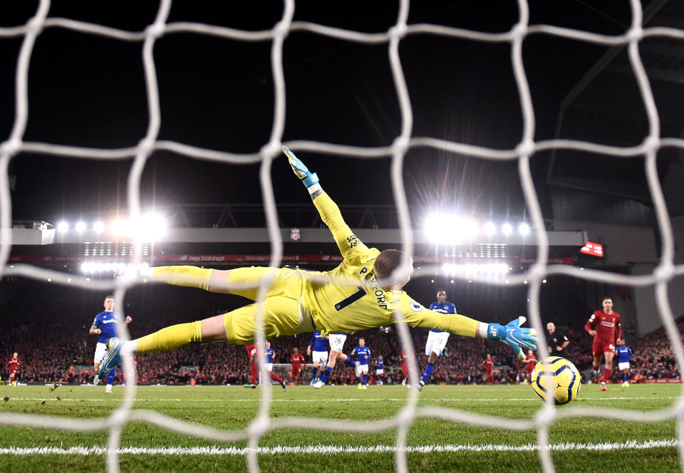 LIVERPOOL, ENGLAND - DECEMBER 04: Sadio Mane of Liverpool scores his team's fourth goal past Jordan Pickford of Everton during the Premier League match between Liverpool FC and Everton FC at Anfield on December 04, 2019 in Liverpool, United Kingdom. (Photo by Laurence Griffiths/Getty Images)