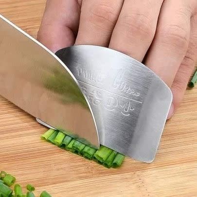 Ensure that you don't accidentally hurt your fingers during food prep by using this (low-key genius) stainless steel guard.