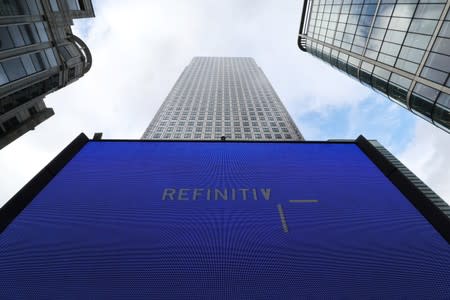 FILE PHOTO: An advertisement for Refinitiv is seen on a screen in London's Canary Wharf financial centre