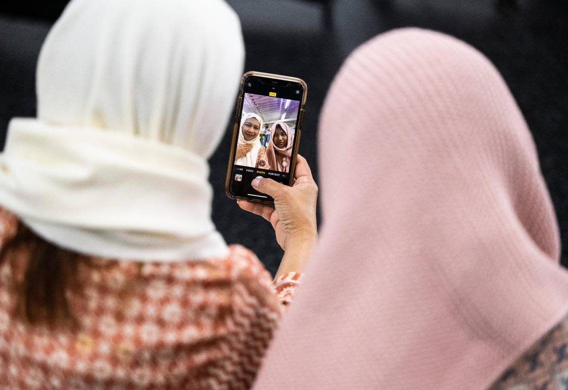 Two woman take a selfie after a prayer that was led by Imam Abdulhakim Mohammed for a celebration of the Islamic holiday, Eid al-Adha, at what will soon be the new Islamic Center on Montana Avenue in Tacoma, on Saturday, July 9, 2022.