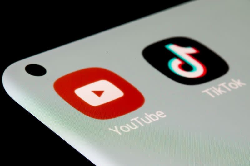 FILE PHOTO: YouTube and TikTok apps are seen on a smartphone in this illustration