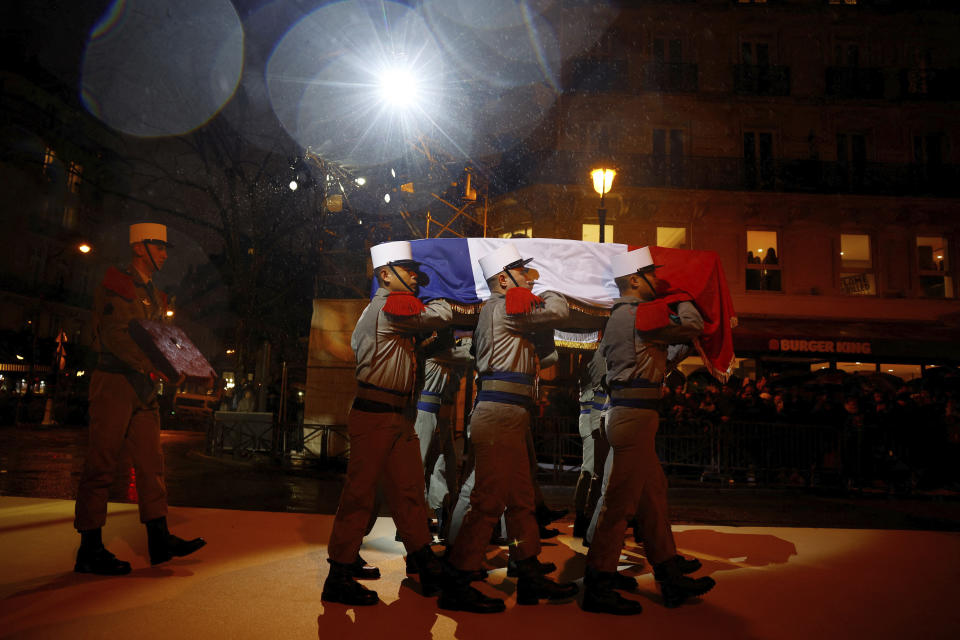 Soldiers from French Foreign Legion carry the coffin of Missak Manouchian during his induction ceremony and his 23 resistance fighters into the Pantheon monument, Wednesday, Feb 21, 2024 in Paris. A poet who took refuge in France after surviving the Armenian genocide, Manouchian was executed in 1944 for leading the resistance to Nazi occupation. (Sarah Meyssonnier/Pool via AP)